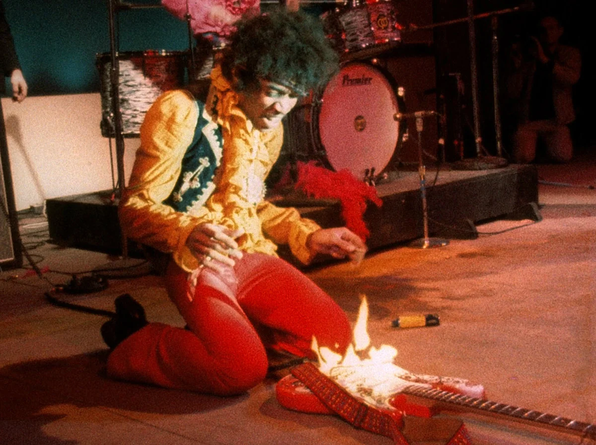 Jimi-hendrix-guitar-on-fire-monterey-live-1967.webp